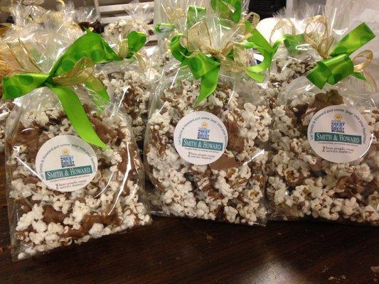 Dark, Milk, and White Chocolate Covered Popcorn available in a variety of sizes.