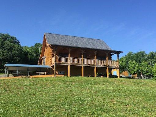 This D-log cabin was designed, manufactured and built by Honest Abe Log Homes near Alexandria, TN.