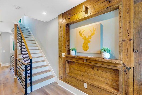 Reclaimed hardwood installation on wall and installation of hardwood floors. Project in DC.