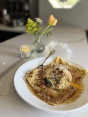 Asparagus stuffed giant ravioli and egg