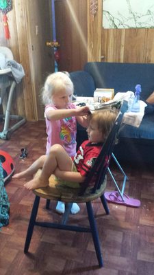 Grandchildren playing hairdresser