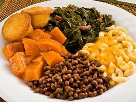 Delicious candy yams, collar greens, cornbread  and red beans, Mac and cheese