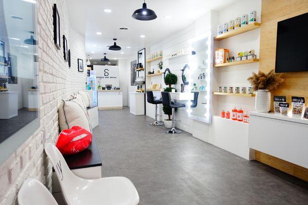 Showroom has a vast selection of products for retail. Center portion of the showroom used for barber, hairstyling and beauty services.