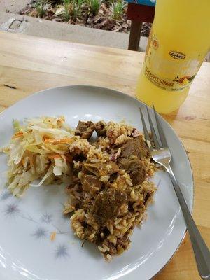 Fruit juice with pineapple and ginger, curried Goat, rice, steamed cabbage