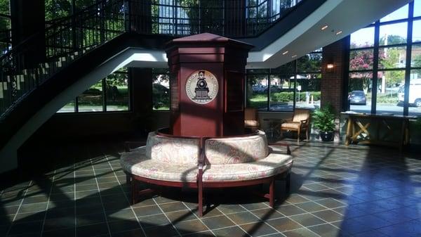 Cushioned seating in the foyer.