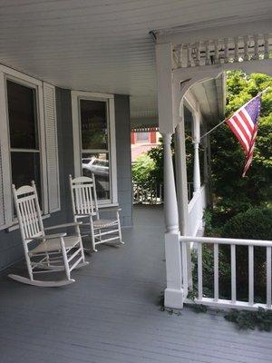 On the porch before you enter.