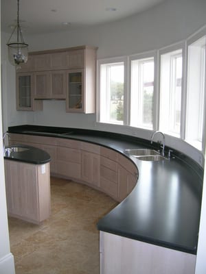 25 foot curved countertop with integral coved backsplash.  No visible seams