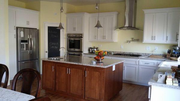 White painted cabinets and stained Alder island with shaker style doors