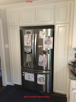 we build a custom cabinets/match doors and paint the cabinets around the fridge