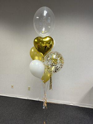 Elegant gold, white and clear balloon bouquet.