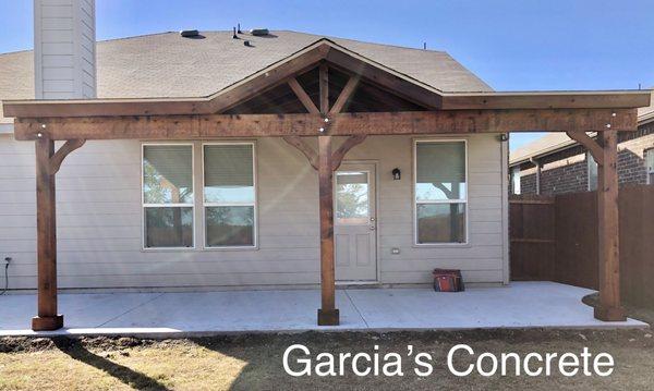 Patio cover cedar wood with pecan stain. Regular brush concrete. This included a permit from City Of Fortworth.