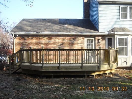 The new deck at the same height as the door threshold