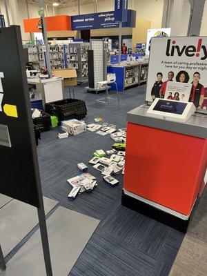 Two young employees stocking shelves dumped all their merchandise onto the floor and walked away.