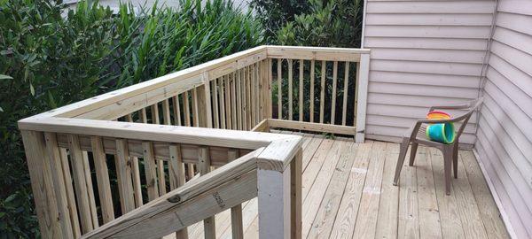 Back porch deck and handrails.