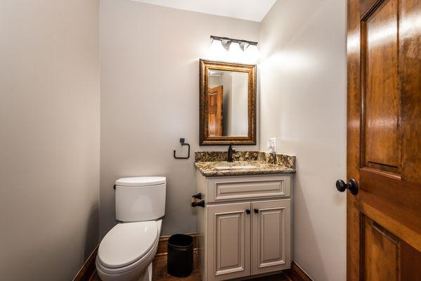 Powder room-refreshed new look with new toilet, faucet and matching tp and towel bars