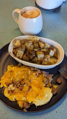 Sausage, egg, cheese and bacon omelette with a side of house potatoes