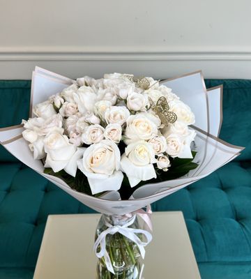 Delicate bouquet of roses and spray roses.