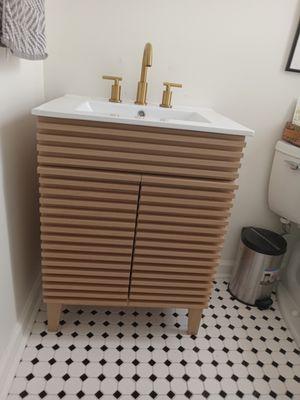 Bathroom vanity, sink and fixure installation.