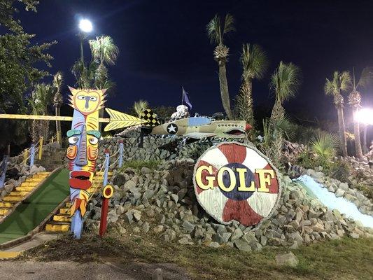 Giant Tiki mask and GOLF sign at Cap'n Cains mini golf!