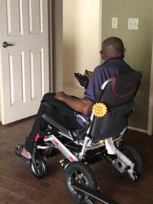 Dad learning to use his new chair from ABC Medical