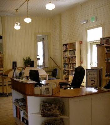 a view of our circulation desk where our dutiful volunteers work their magic...