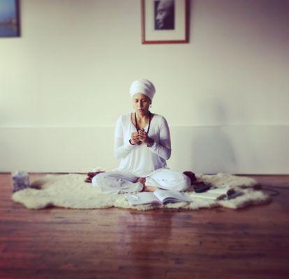 Avtar Shabad Kaur in her Tuesday morning Kundalini yoga class at Spirit Rising.