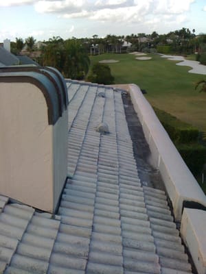 This Adobe style house with its tile roof sloping into a parapet wall was no easy task, extra precautions had to be taken to ...