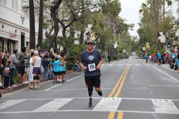 Achilles Patient Keith running the State St. Mile.