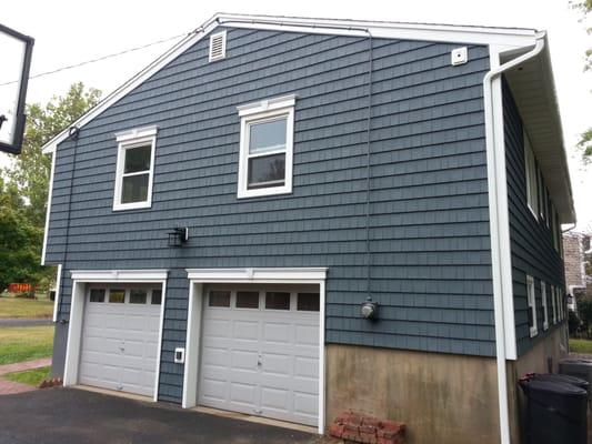 Pelican Bay One Traditional Shake (midnight blue) vs. white trim, decorative headers above garage doors and windows