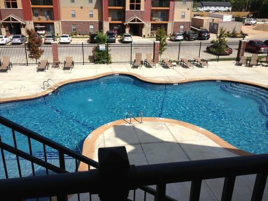 Swimming pool next to BBQ grills