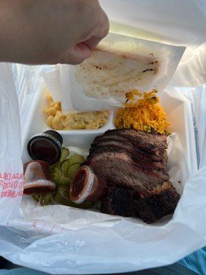 A Side of macaroni, rice, and 2 servings of brisket. $27