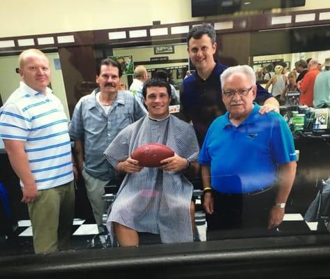 Cool pic with the barbers and Luke Kuechly. From when he made a CPI security commercial.