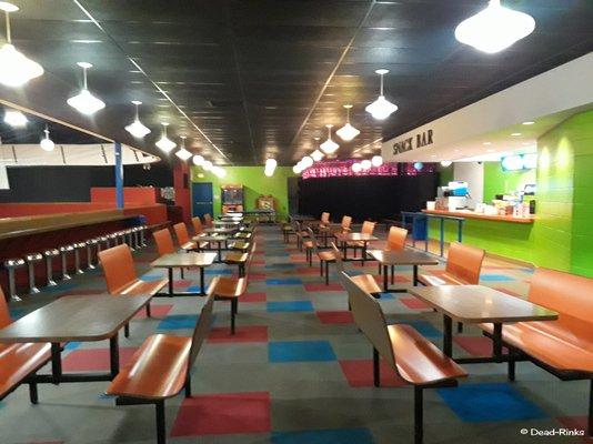 Eating area.  Yes, you can even see the malt shop style stools on the left for fans to sit watching skaters go by.