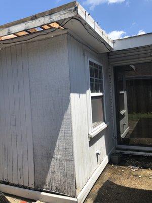 West Renovation- before. Exterior siding, fascia, & roofing  damaged. Siding sustained termite damage.