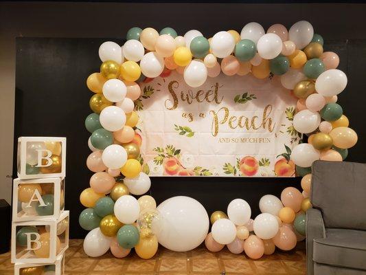 What a peach baby shower arch