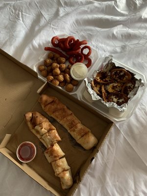 Pepperoni roll, potato skins, fried mushrooms and spicy onion rings