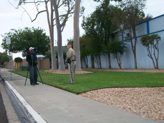 CHP officer being interviewed by TV station about effects of rainstorm on the roadways.