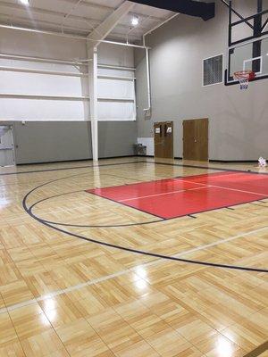 New gymnasium with dual volleyball courts.