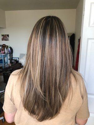 Full head of blonde highlights on dark brown hair- back view