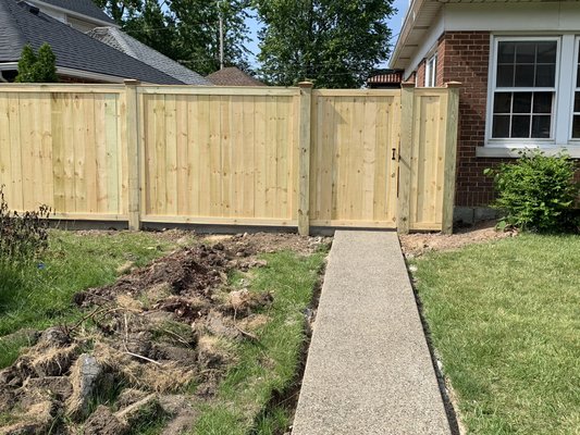 Pressure treated wood fence in a picture frame style