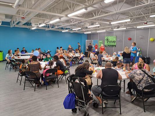 Grand Opening Event. Customers eating in the Advent Health Room.