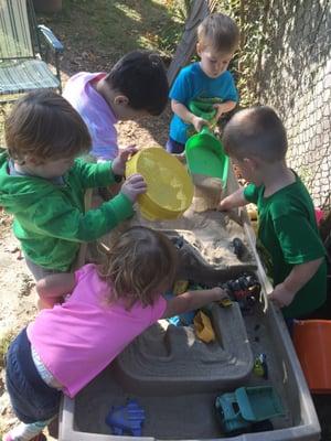 They love playing in the sand box