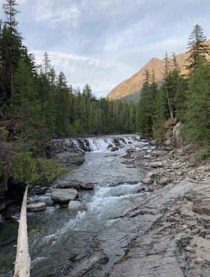 Sacred Dancing Cascades viewed from a wooden bridge