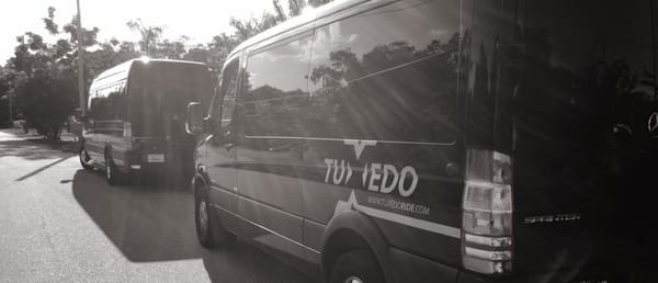 Decals on TUXEDO shuttle vans