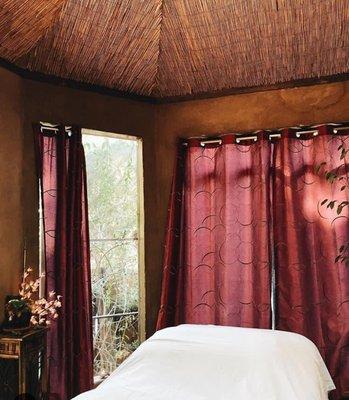 This is adobe octagon. A nature oasis where you receive an amazing massage surrounded by lush trees, butterflies, birds and flowers.