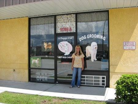 Nannette Carlo, owner, standing in front of her store.