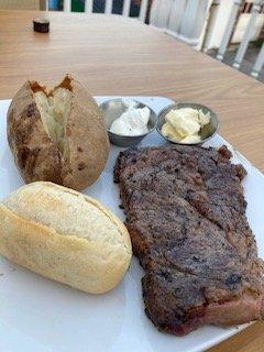 Ribeye with baked potato