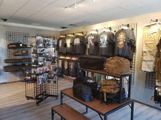 We also carry patriotic and 2A Tee-shirts as well as cargo pants, shorts, ladies' Camo shirts, leggings, gun cases and range bags.