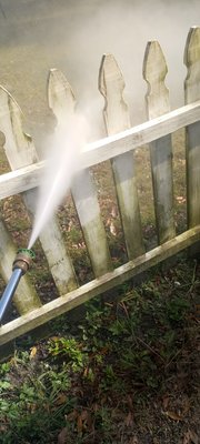 pre cleaning a fence before painting