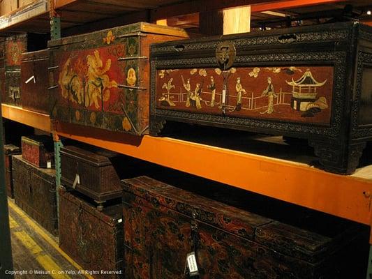 A variety of Chinese carved and painted wood chests.